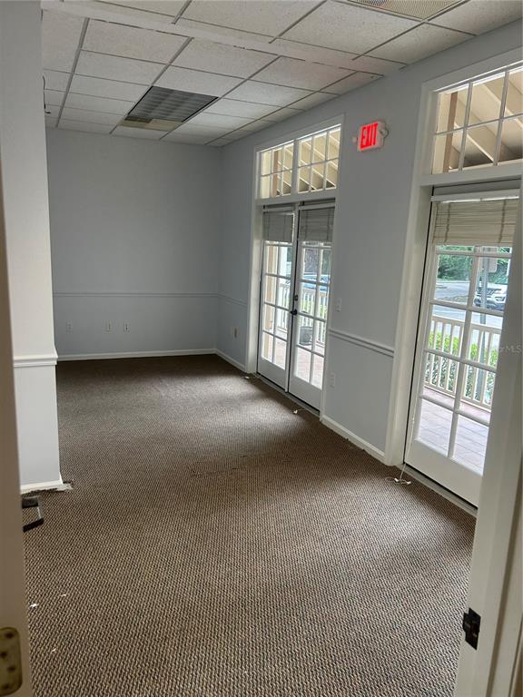 5214 Southwest 91 Terrace Gainesville, FL 32608 - Photo 6 of 9 a view of an empty room with a window