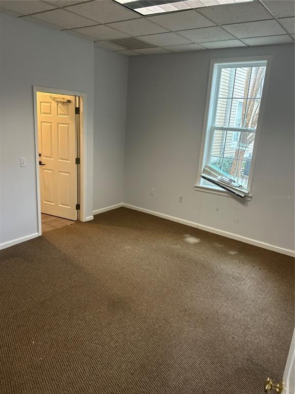 5214 Southwest 91 Terrace Gainesville, FL 32608 - Photo 7 of 9 an empty room with windows