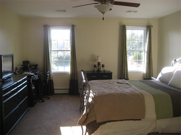 11 Comstock Place Rochester, MA 02770 - Photo 18 of 21 a bedroom with a bed and a window