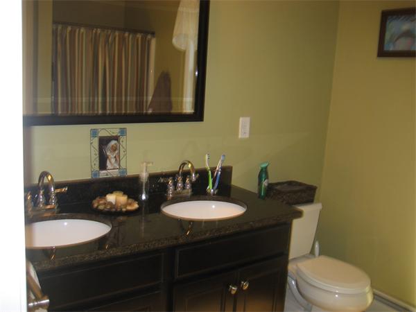 11 Comstock Place Rochester, MA 02770 - Photo 20 of 21 a bathroom with a sink and a toilet