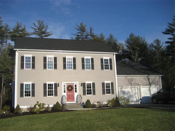 11 Comstock Place Rochester, MA 02770 - Photo 2 of 21 a front view of a house with a garden