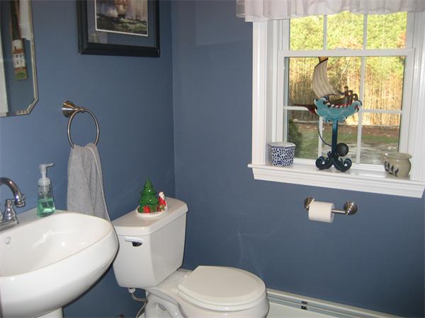 11 Comstock Place Rochester, MA 02770 - Photo 21 of 21 a white toilet sitting next to a bathroom sink