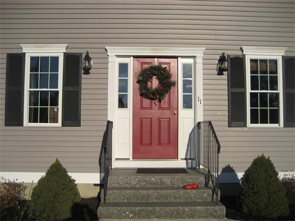 11 Comstock Place Rochester, MA 02770 - Photo 3 of 21 a front view of a house with a yard