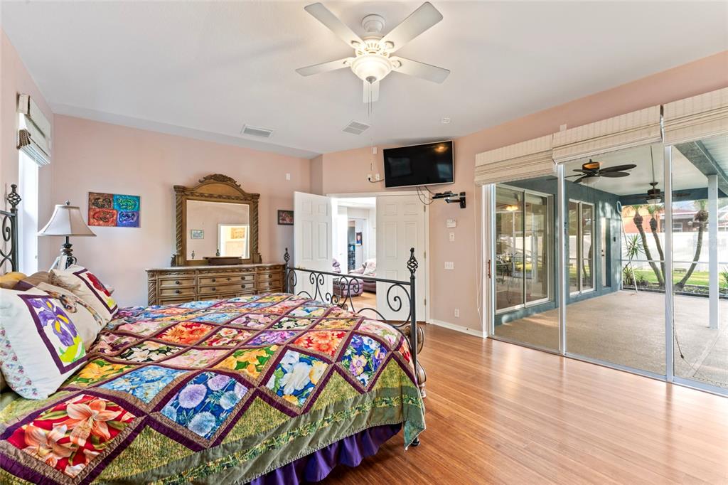 12833 Darby Ridge Drive Tampa, FL 33624 - Photo 25 of 33 a bedroom with a bed and a chandelier