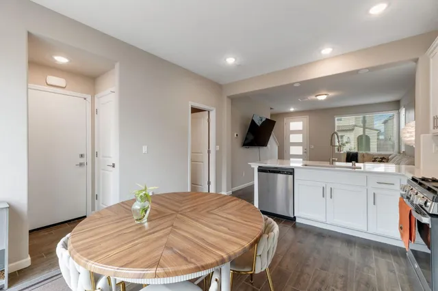 a kitchen with a table and chairs in it