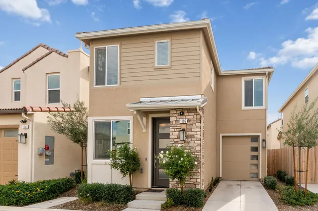 a front view of a house with garden