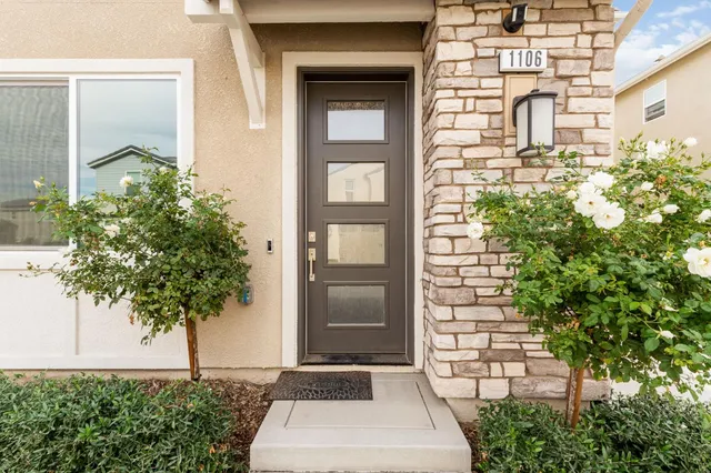 a front view of a house with a yard