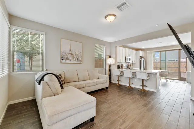 a living room with furniture and a large window
