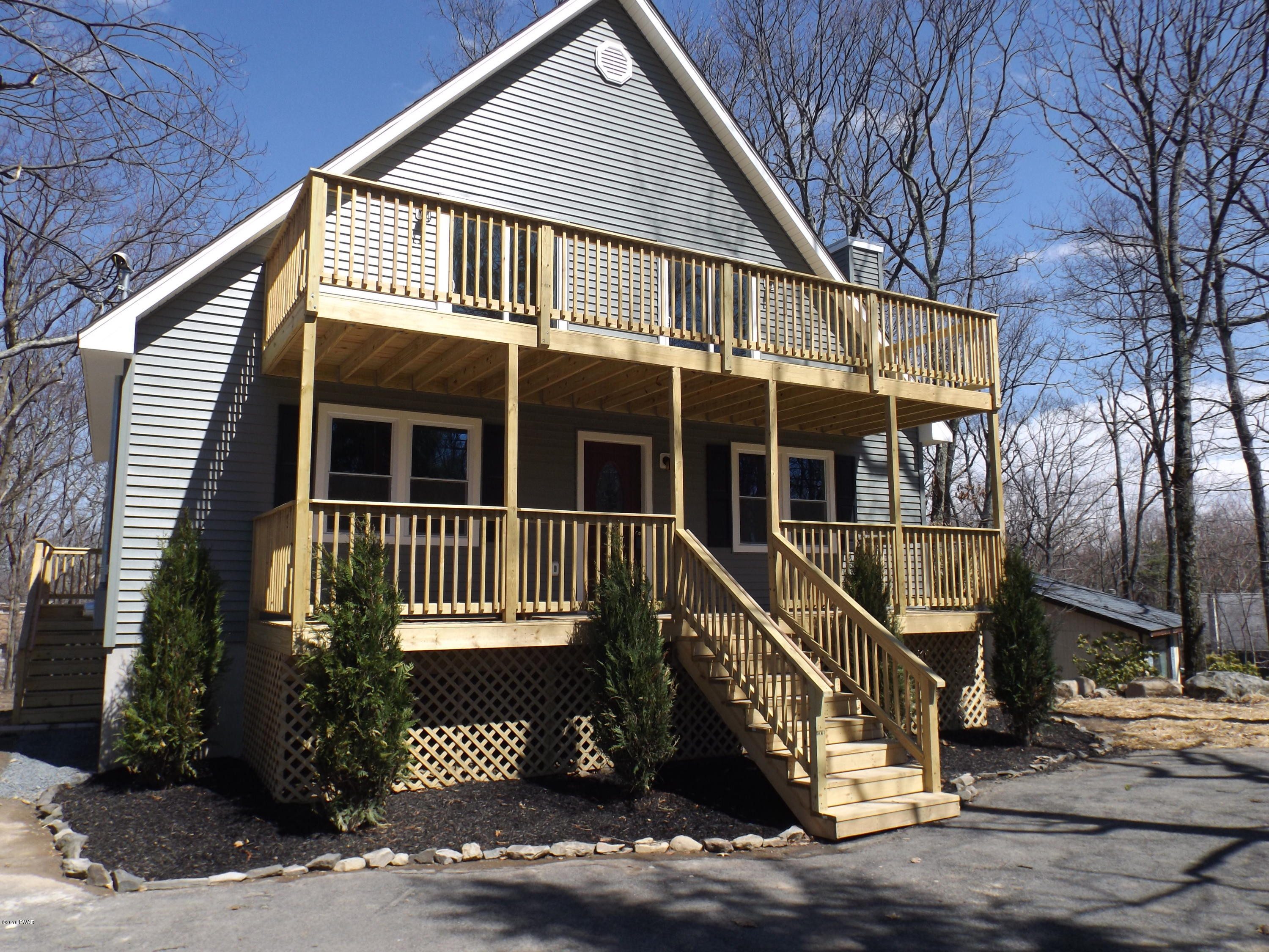 109 Keystone Court Dingmans Ferry, PA 18328 - Photo 1 of 18 a front view of a house with a yard
