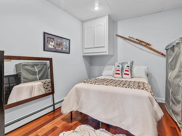 15 Riverview Avenue, Unit D Mashpee, MA 02649 - Photo 18 of 33 a bedroom with a bed and a couch