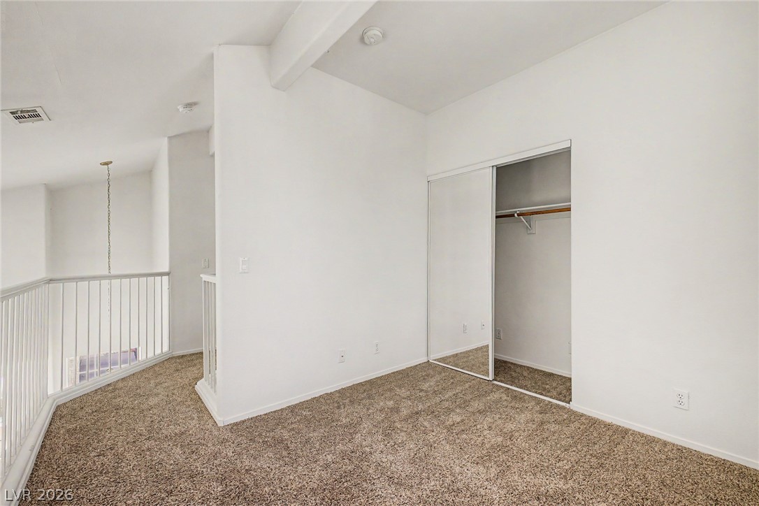 2223 Ramsgate Drive Henderson, NV 89074 - Photo 12 of 32 A well-lit loft space featuring an accessible mirrored closet.