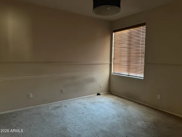 a kitchen with a stove sink and cabinets