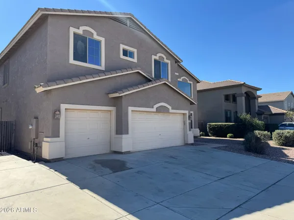 a front view of a house with yard
