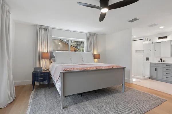 a living room with a bed furniture and a window