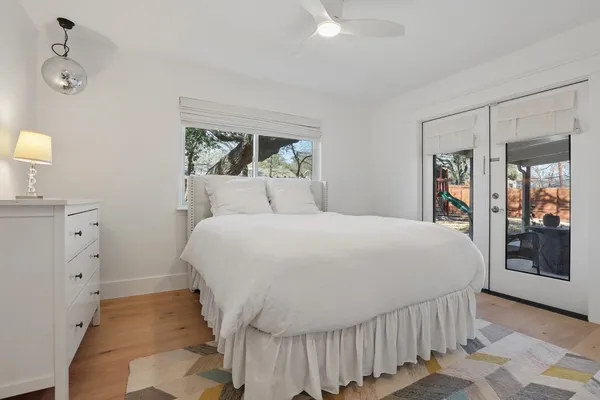 a bedroom with a bed and a dresser