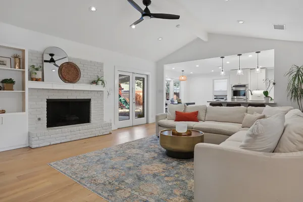 a living room with furniture and a fireplace