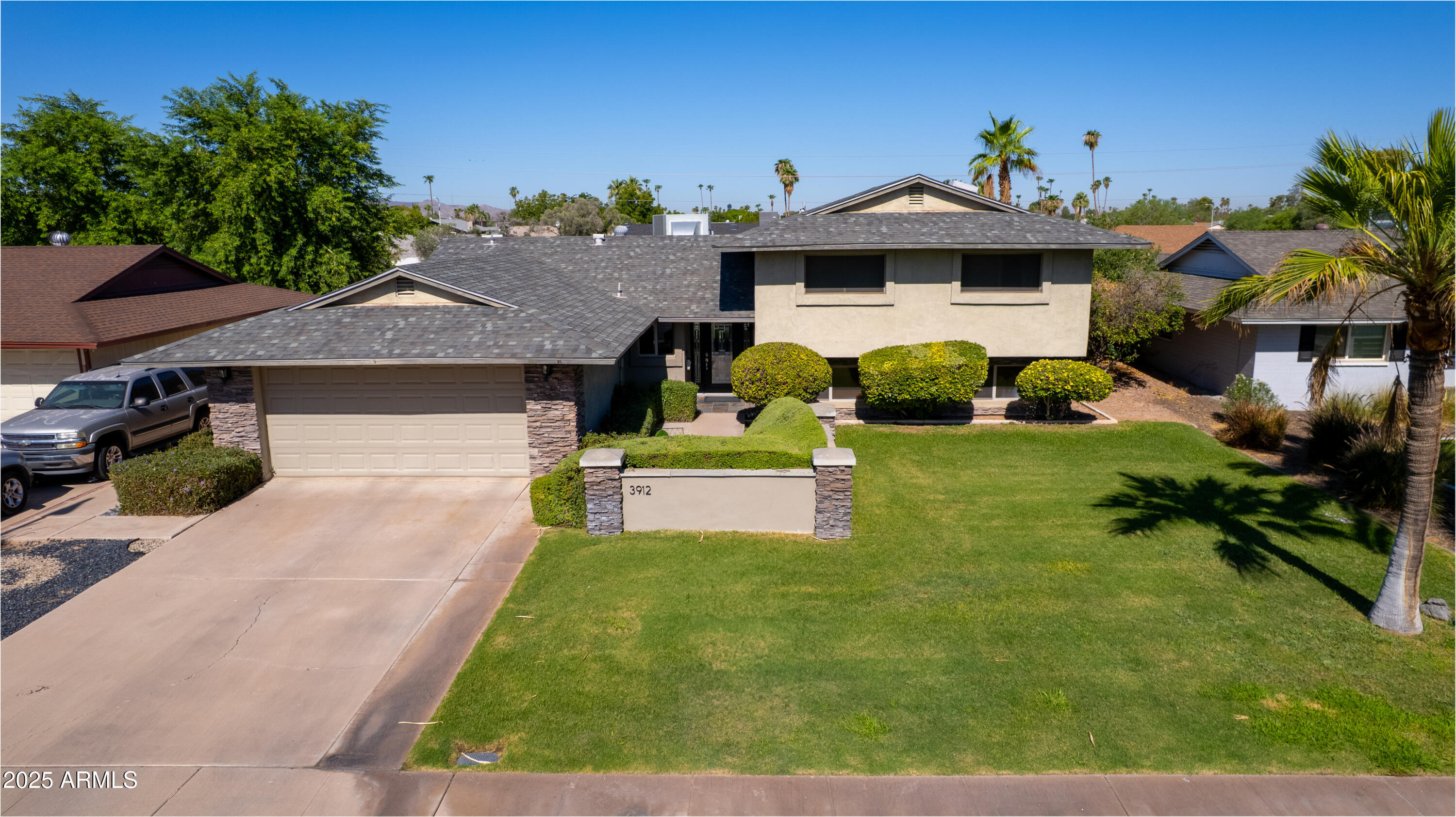 3912 South Elm Street Tempe, AZ 85282 - Photo 1 of 33 a front view of a house with garden