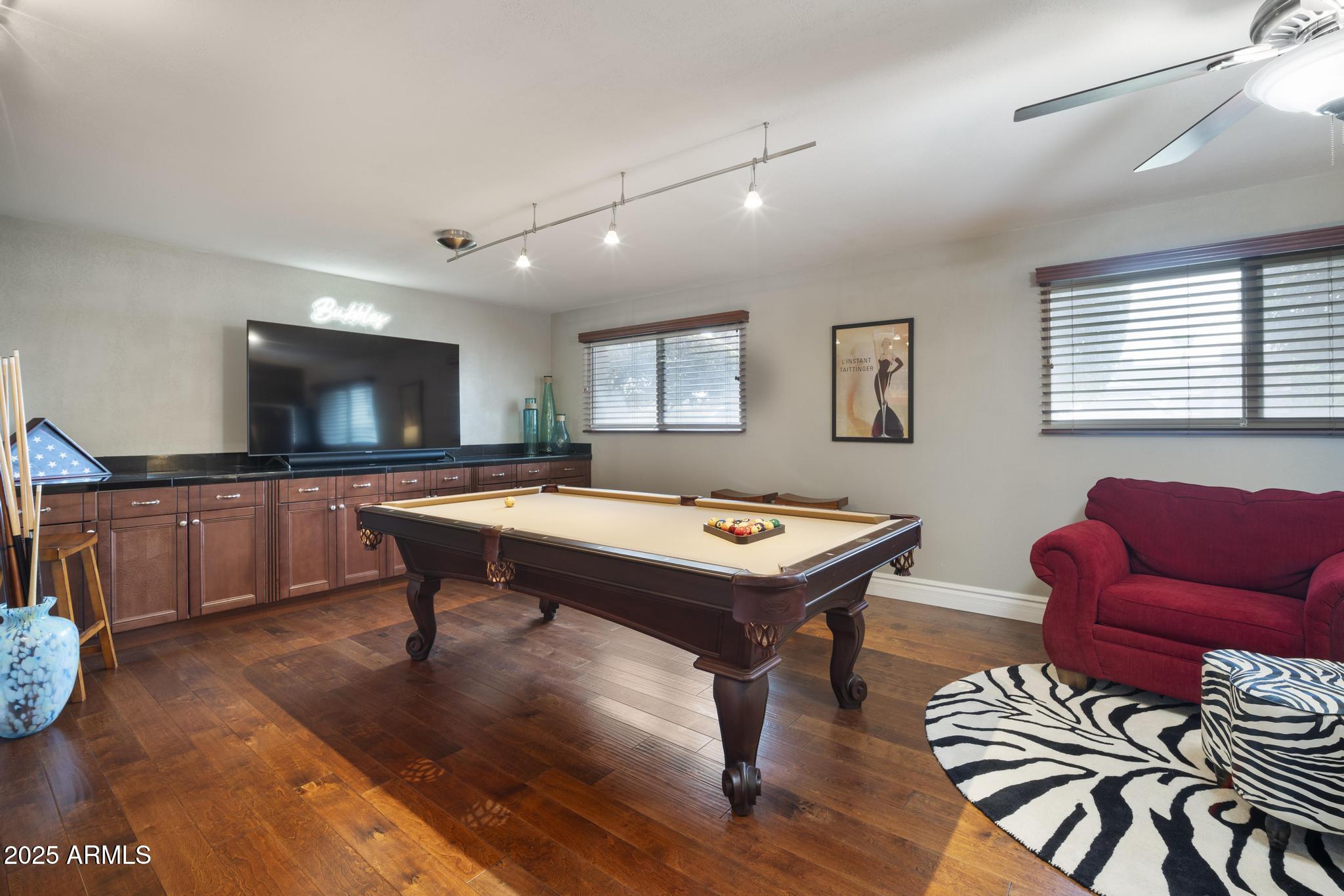 3912 South Elm Street Tempe, AZ 85282 - Photo 11 of 33 a living room with furniture a flat screen tv and kitchen view