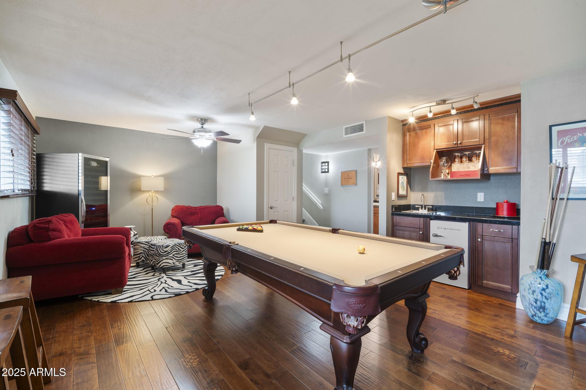 3912 South Elm Street Tempe, AZ 85282 - Photo 13 of 33 a room with furniture pool table flat screen tv and a chandelier