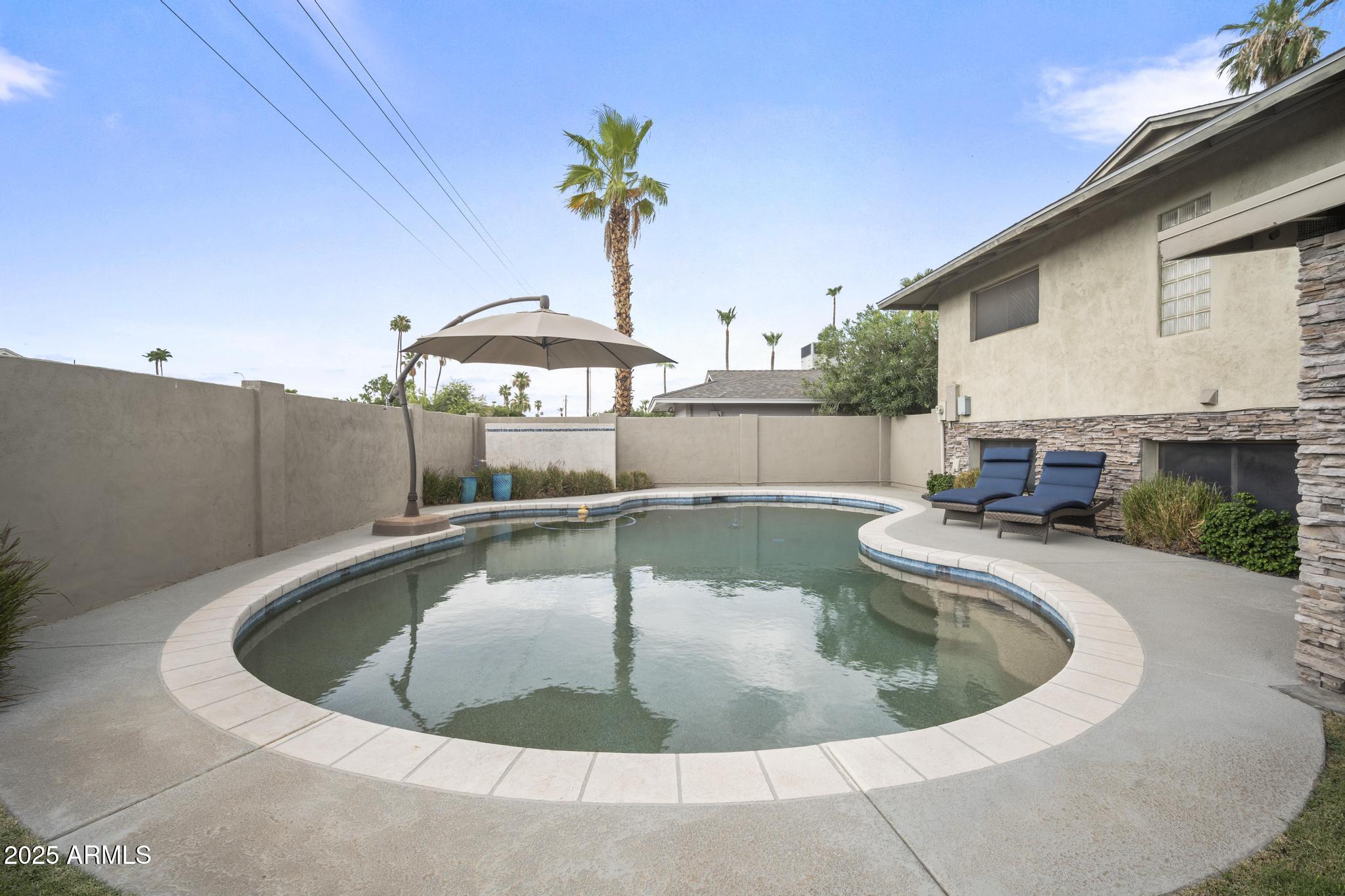3912 South Elm Street Tempe, AZ 85282 - Photo 25 of 33 a view of a swimming pool with a patio