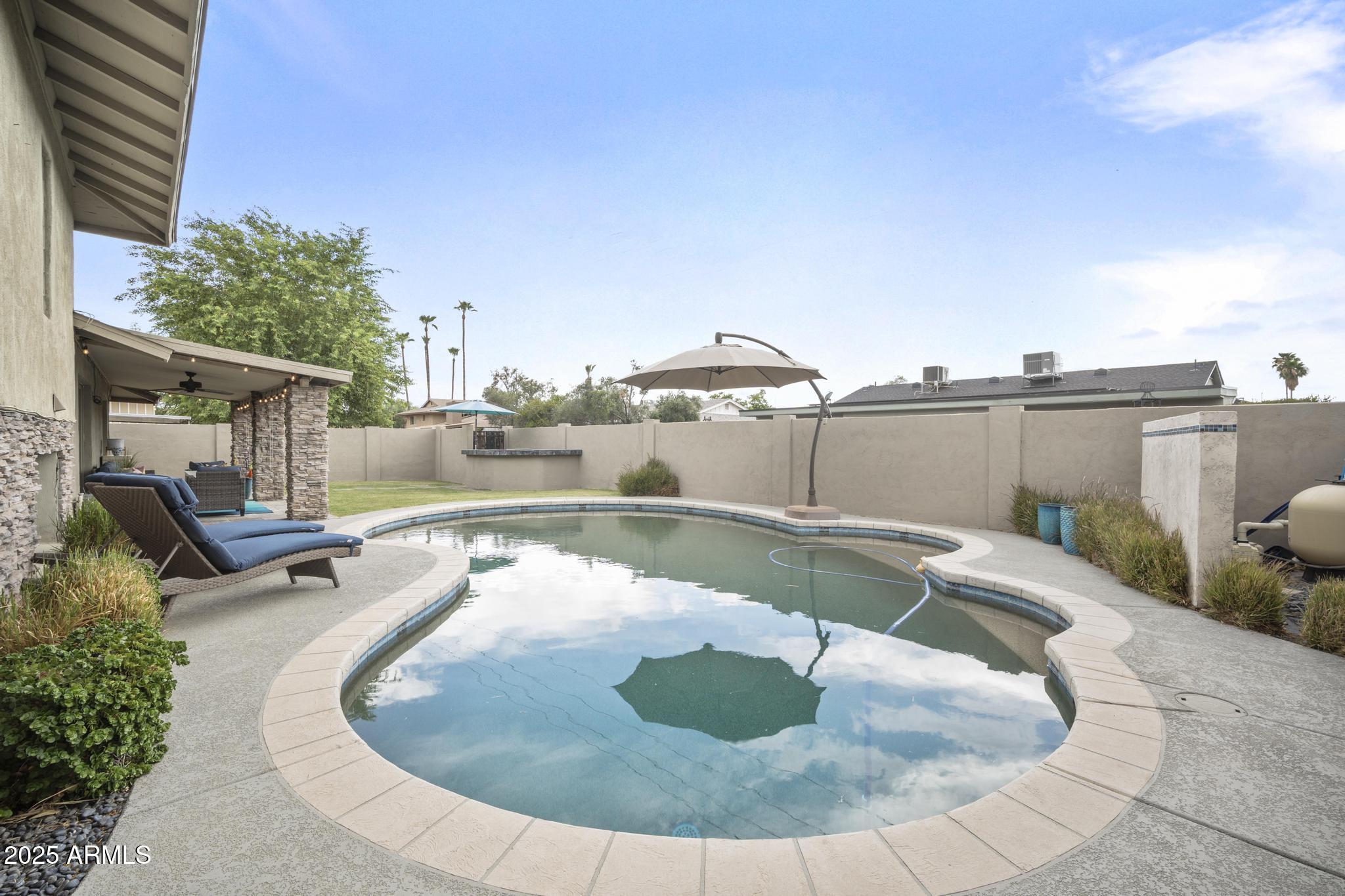 3912 South Elm Street Tempe, AZ 85282 - Photo 26 of 33 a view of a swimming pool with a patio