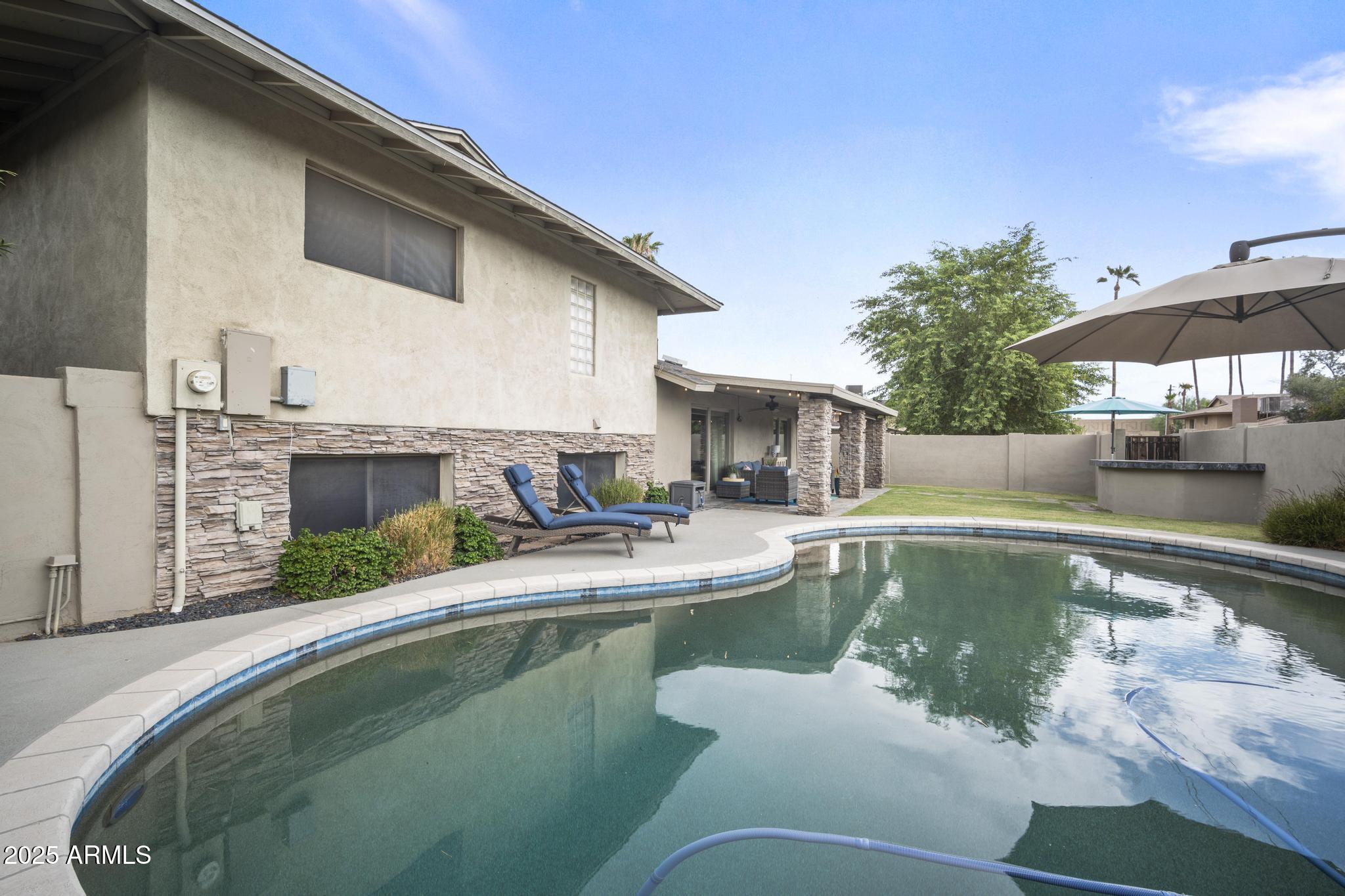 3912 South Elm Street Tempe, AZ 85282 - Photo 27 of 33 a swimming pool with outdoor seating and yard