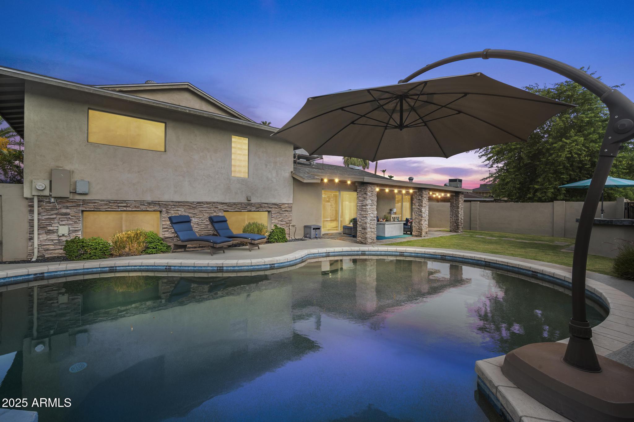 3912 South Elm Street Tempe, AZ 85282 - Photo 3 of 33 a view of house with swimming pool and sitting area