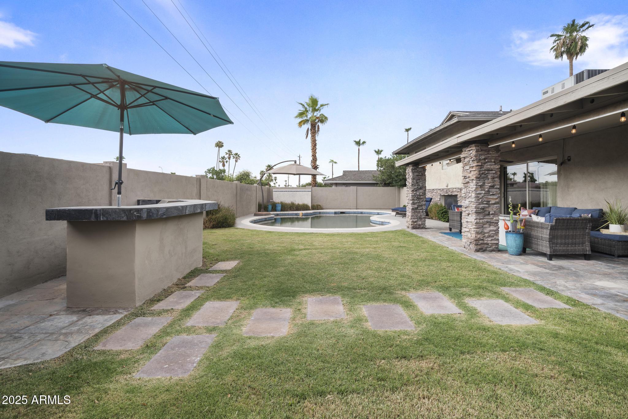 3912 South Elm Street Tempe, AZ 85282 - Photo 33 of 33 a house view with a sitting space and garden space