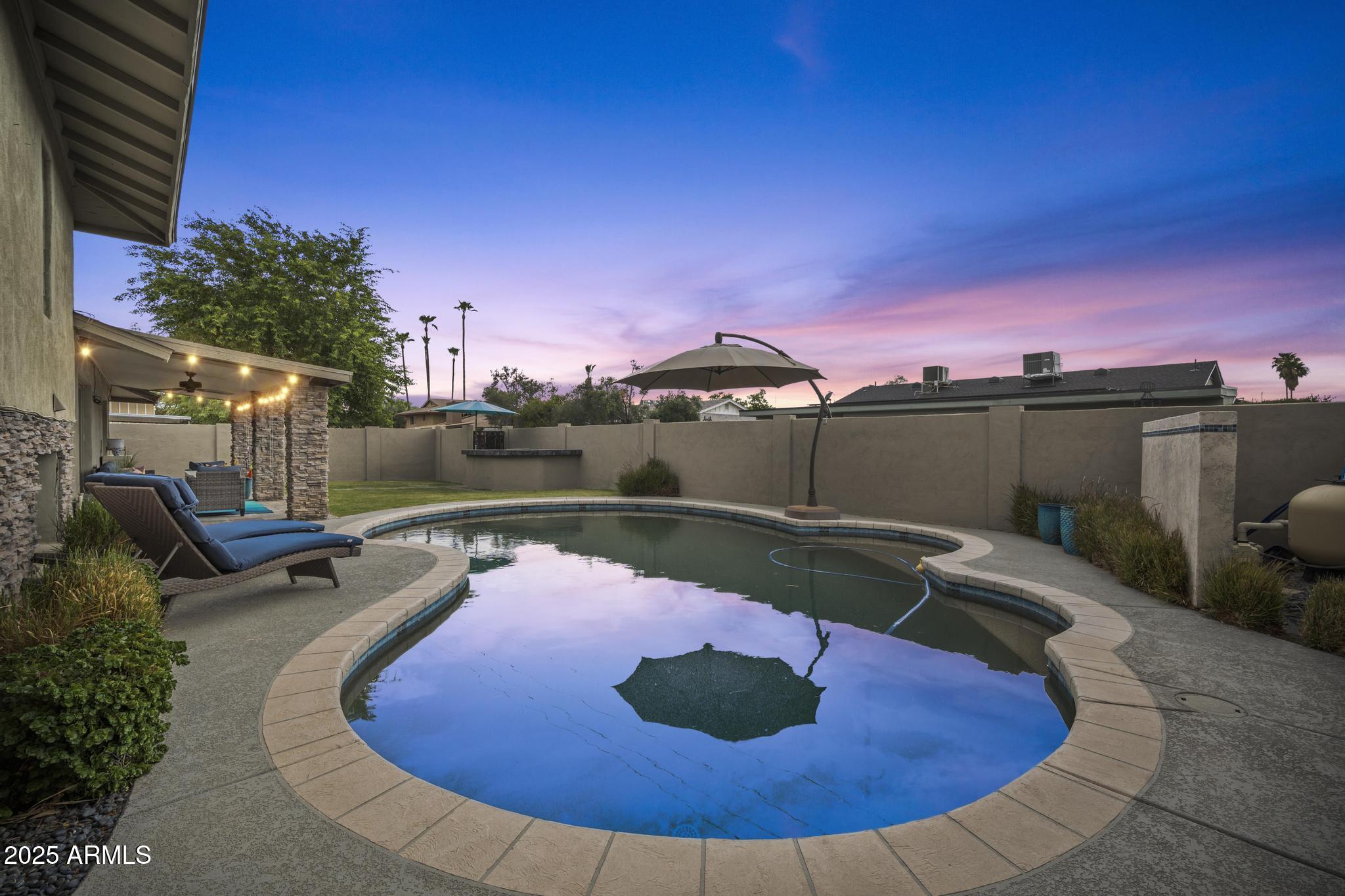 3912 South Elm Street Tempe, AZ 85282 - Photo 4 of 33 a view of a swimming pool with a patio
