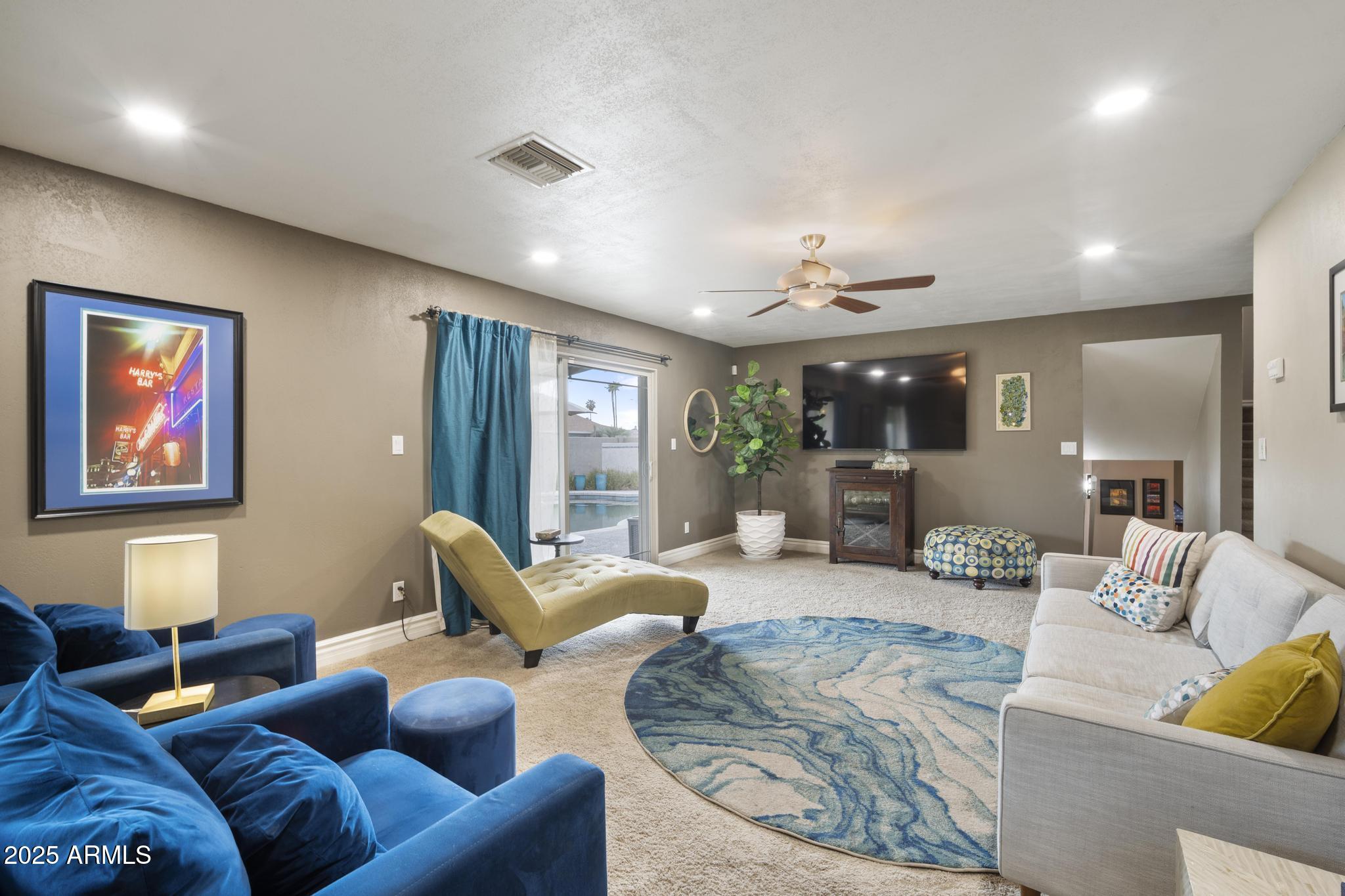 3912 South Elm Street Tempe, AZ 85282 - Photo 9 of 33 a living room with furniture and a large window