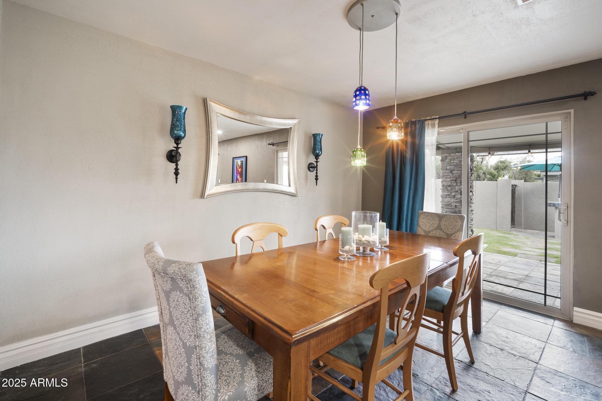 3912 South Elm Street Tempe, AZ 85282 - Photo 10 of 33 a dining room with furniture a chandelier and window