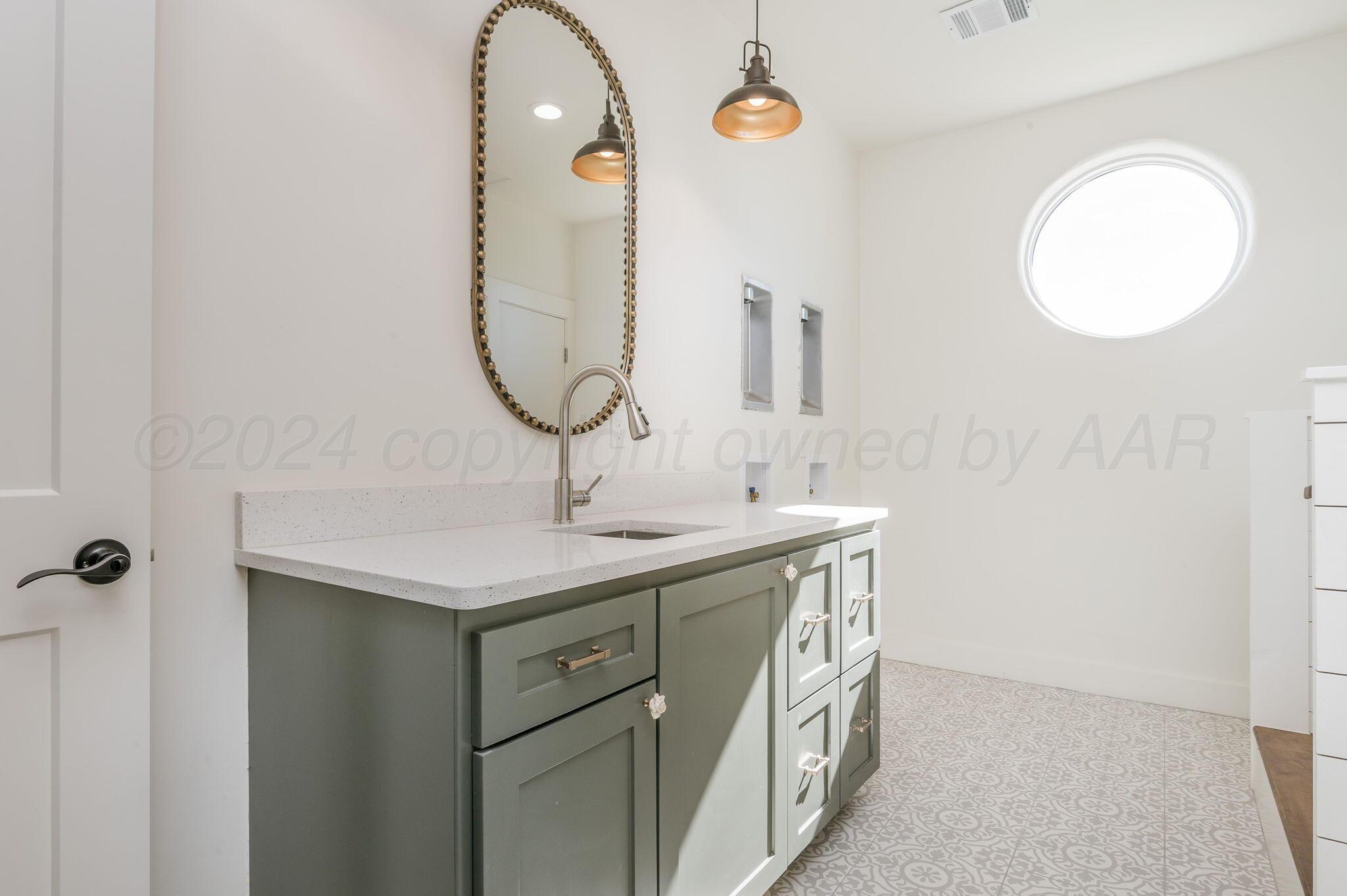 13351 Genevieve's Way Amarillo, TX 79118 - Photo 26 of 35 a bathroom with a sink and a mirror