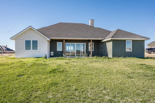 a brick house with a yard