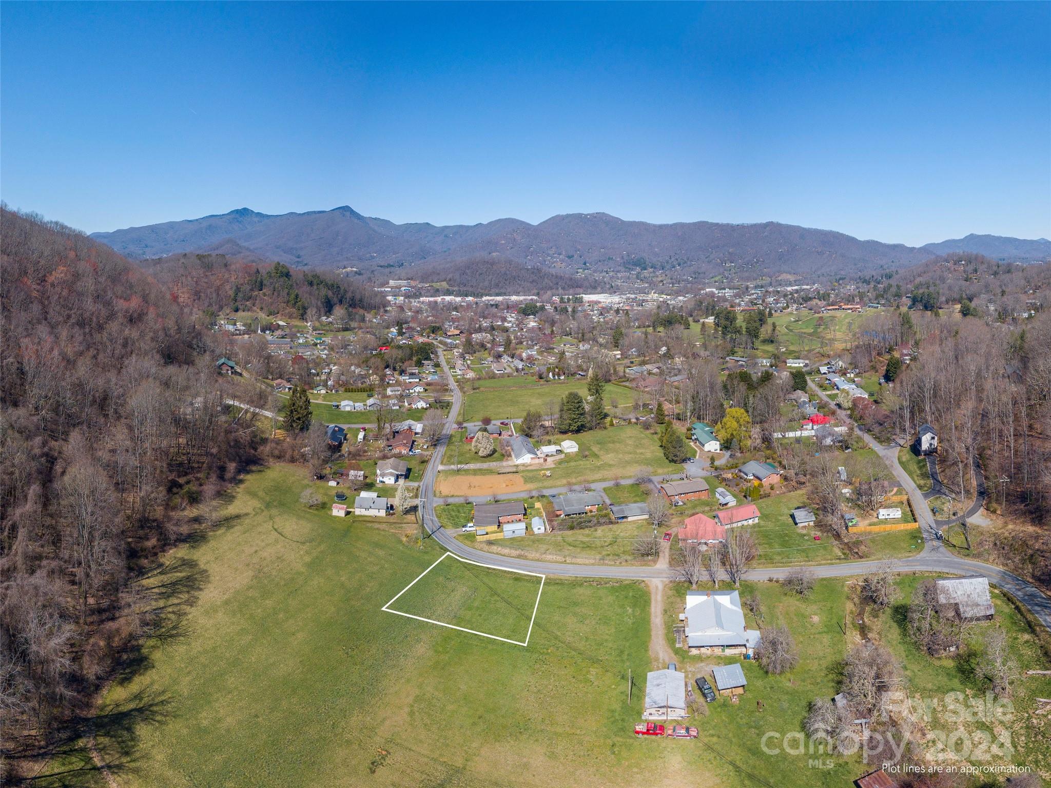 0 Camp Branch Road Waynesville, NC 28786 - Photo 1 of 8 a view of a lake with mountains in the background