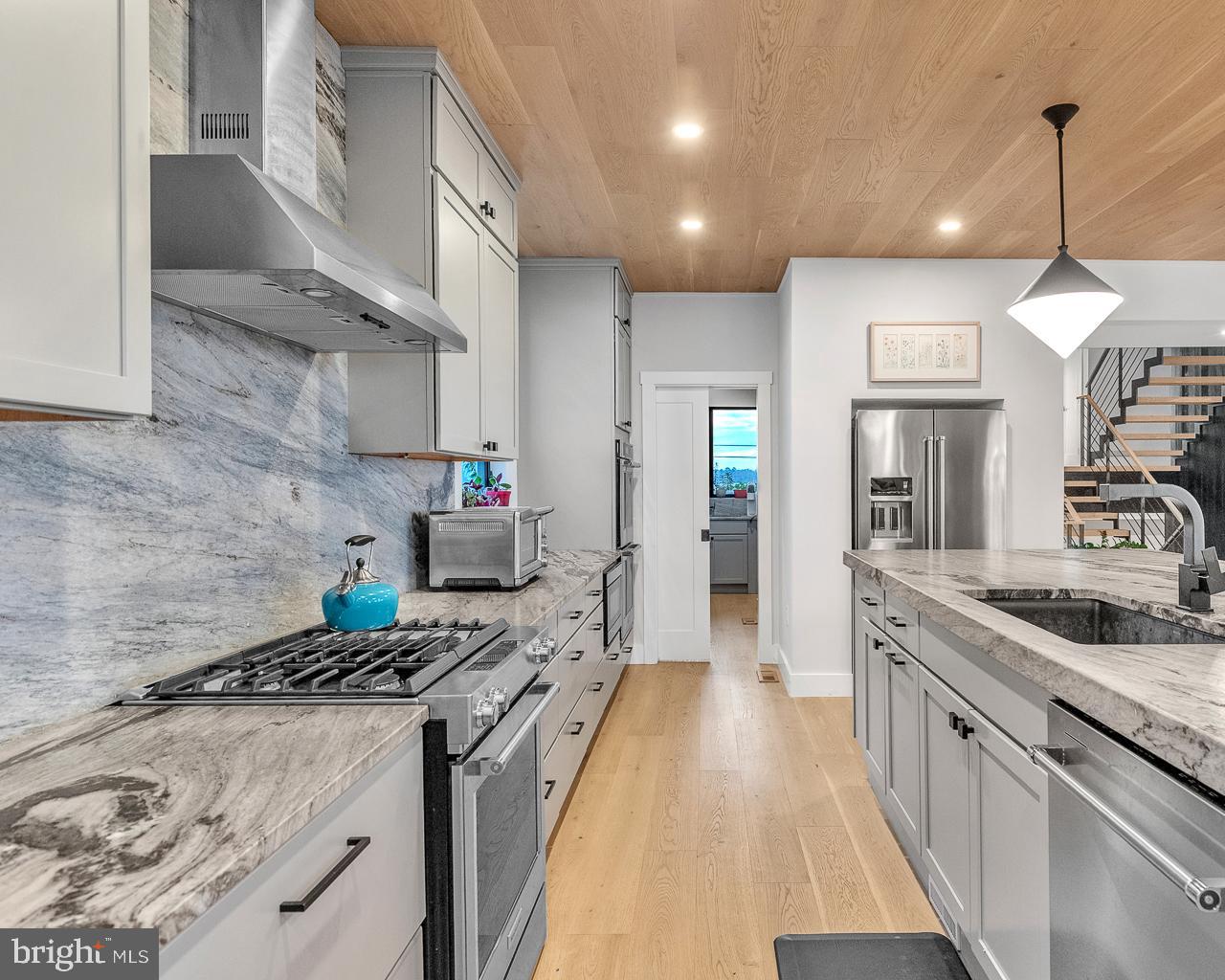 637 Cedar Run Dock Road West Creek, NJ 08092 - Photo 10 of 50 a kitchen with stainless steel appliances granite countertop a sink stove and refrigerator