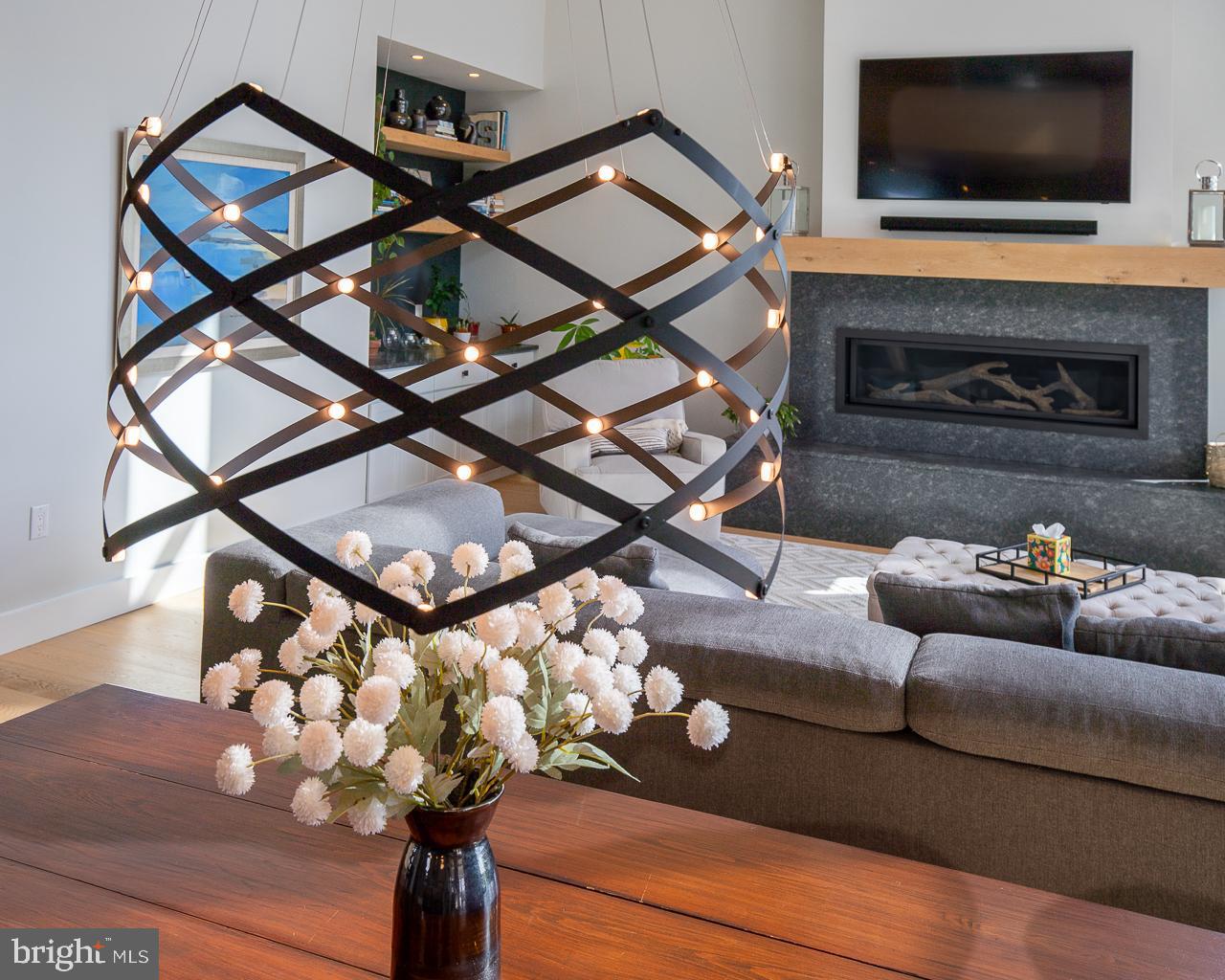 637 Cedar Run Dock Road West Creek, NJ 08092 - Photo 13 of 50 a living room with furniture a flat screen tv and a fireplace