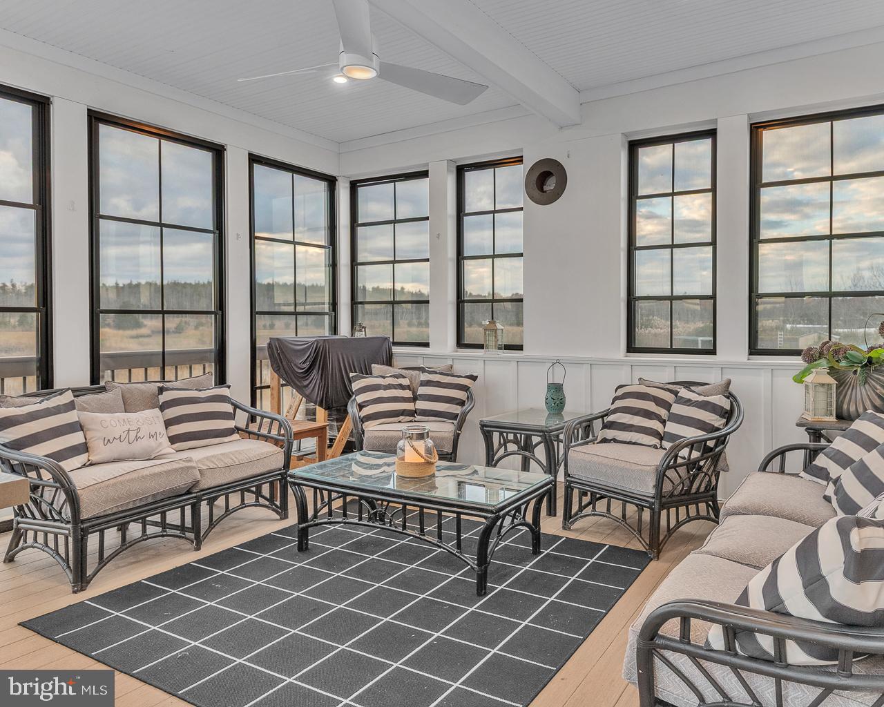 637 Cedar Run Dock Road West Creek, NJ 08092 - Photo 14 of 50 a bedroom with furniture and a large window