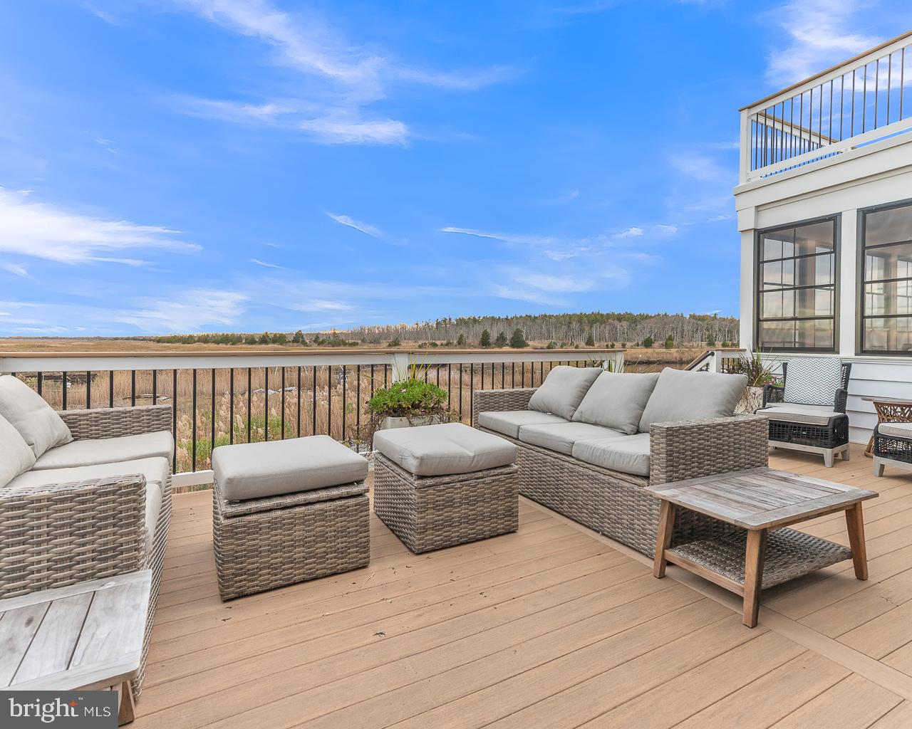 637 Cedar Run Dock Road West Creek, NJ 08092 - Photo 17 of 50 a view of roof deck with couches and wooden floor