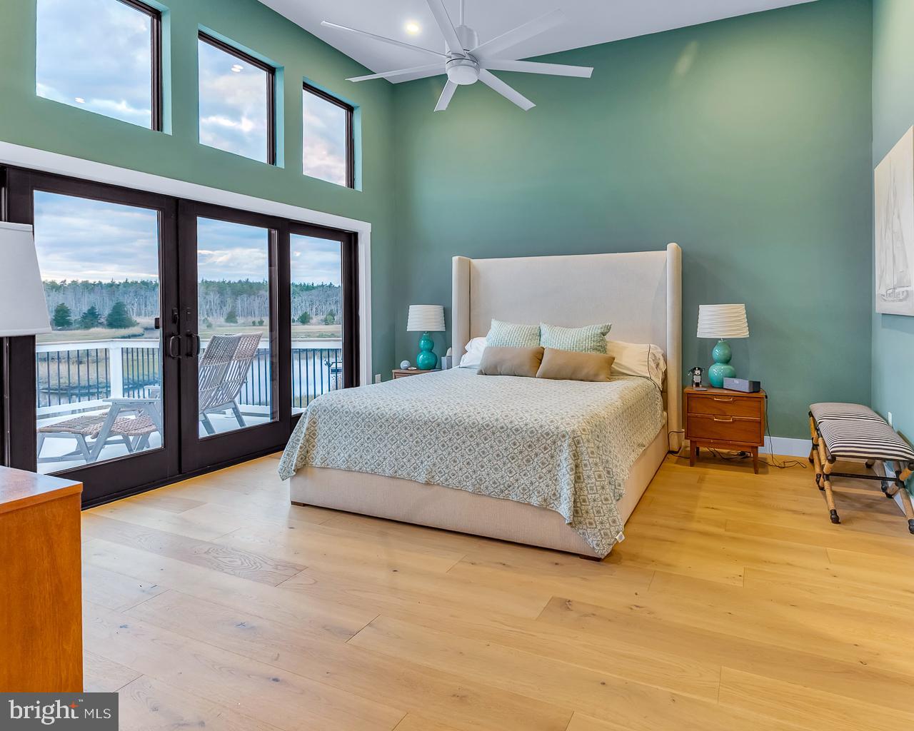 637 Cedar Run Dock Road West Creek, NJ 08092 - Photo 19 of 50 a spacious bedroom with a large bed and a large window
