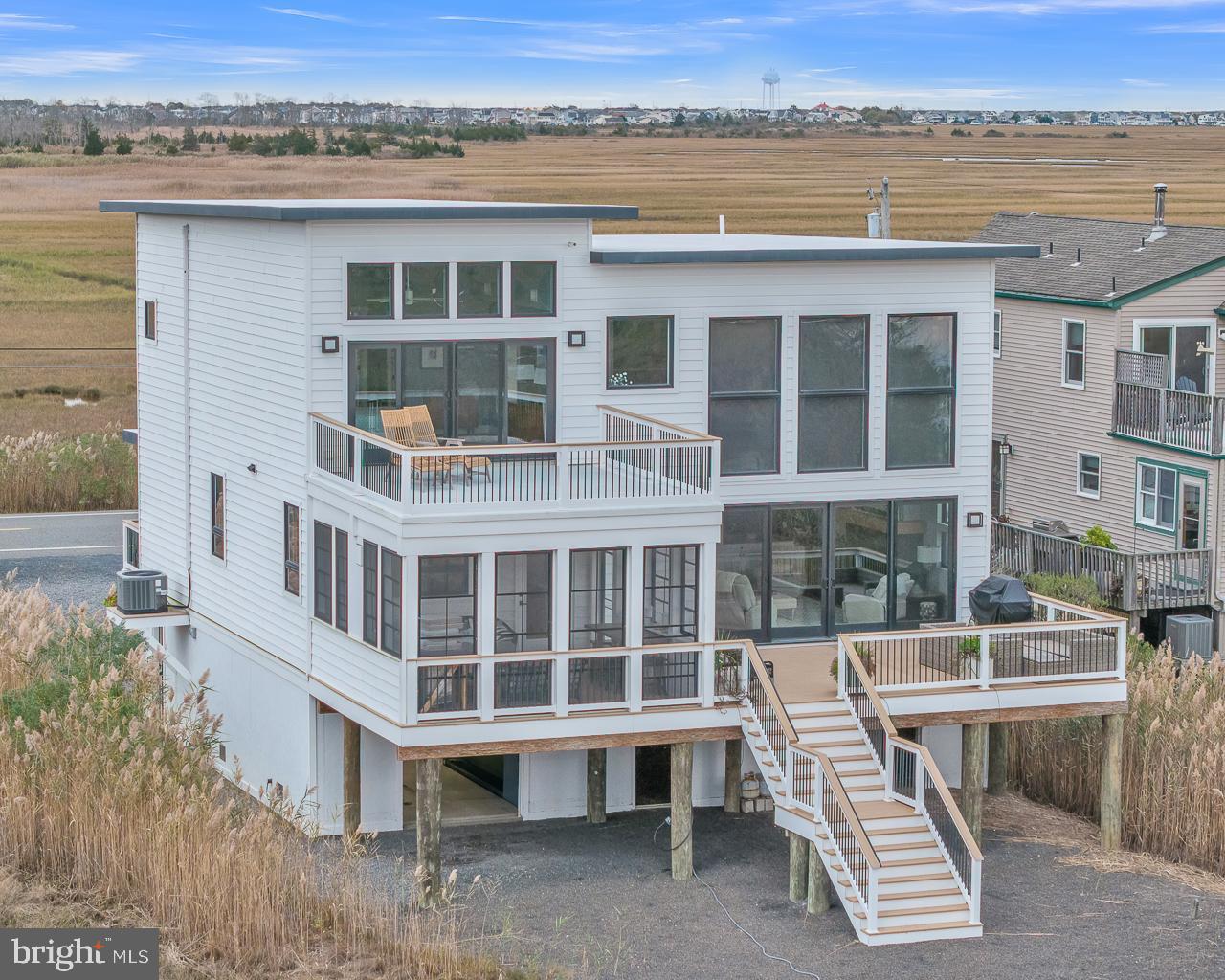 637 Cedar Run Dock Road West Creek, NJ 08092 - Photo 2 of 50 a view of a large building with a balcony