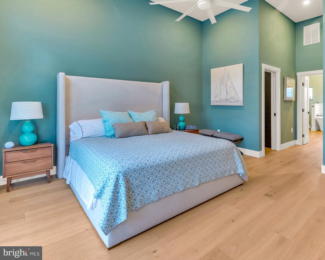 637 Cedar Run Dock Road West Creek, NJ 08092 - Photo 20 of 50 a bedroom with a bed and a night stand