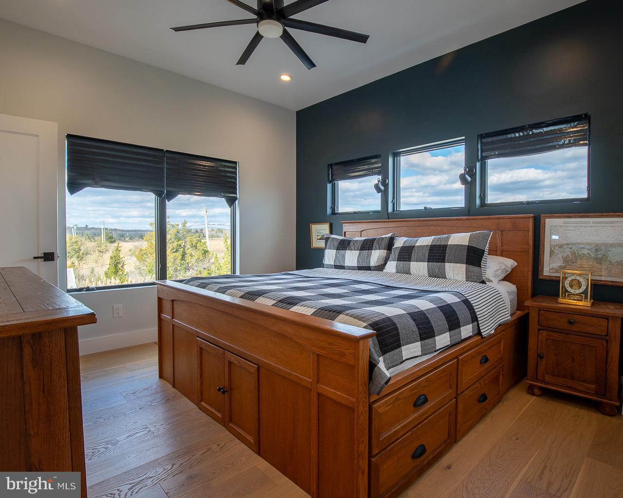 637 Cedar Run Dock Road West Creek, NJ 08092 - Photo 27 of 50 a bedroom with a bed and a large window