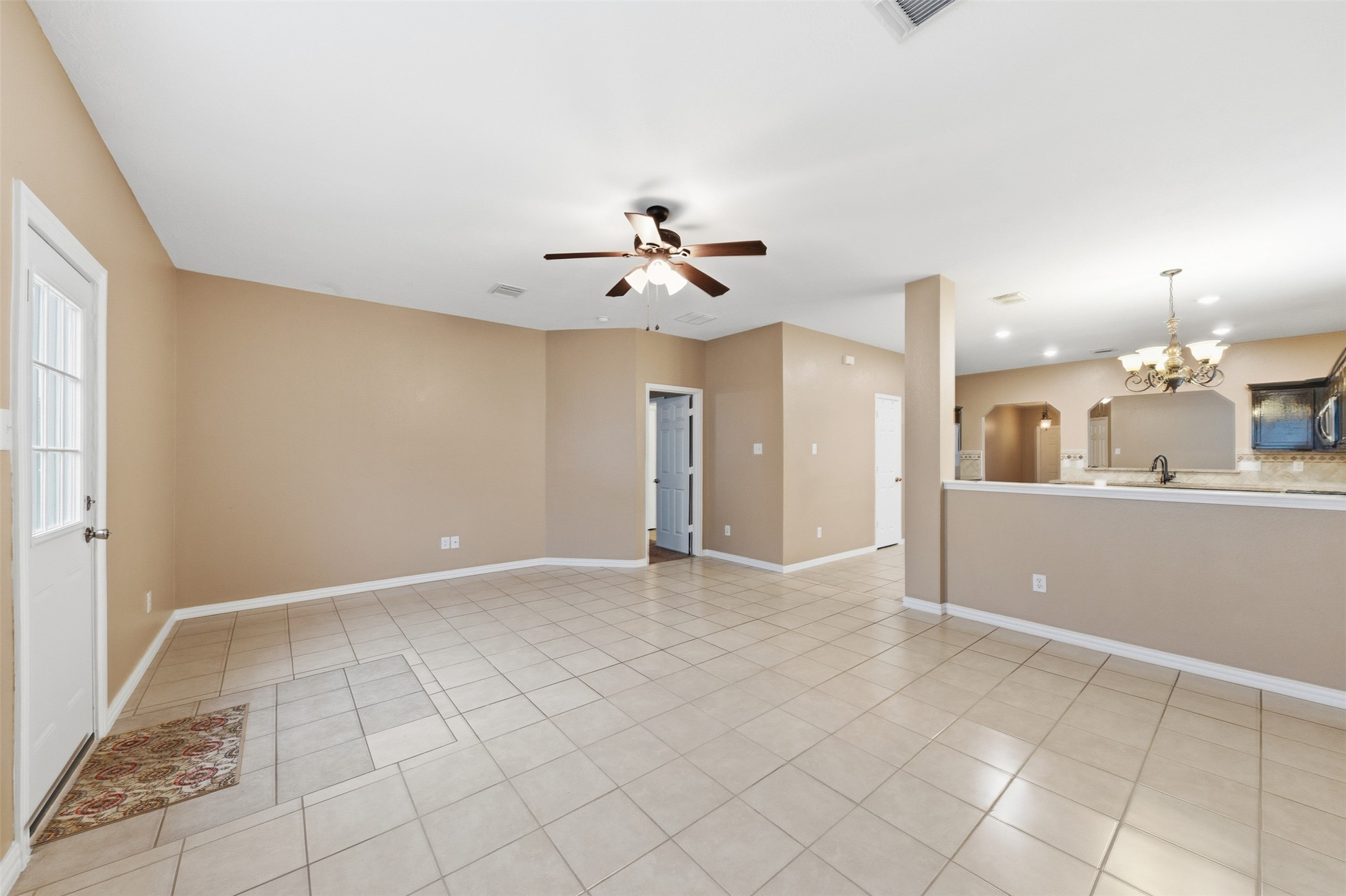 19710 Yaupon Ranch Drive Cypress, TX 77433 - Photo 11 of 34 an empty room with cabinet and a ceiling fan