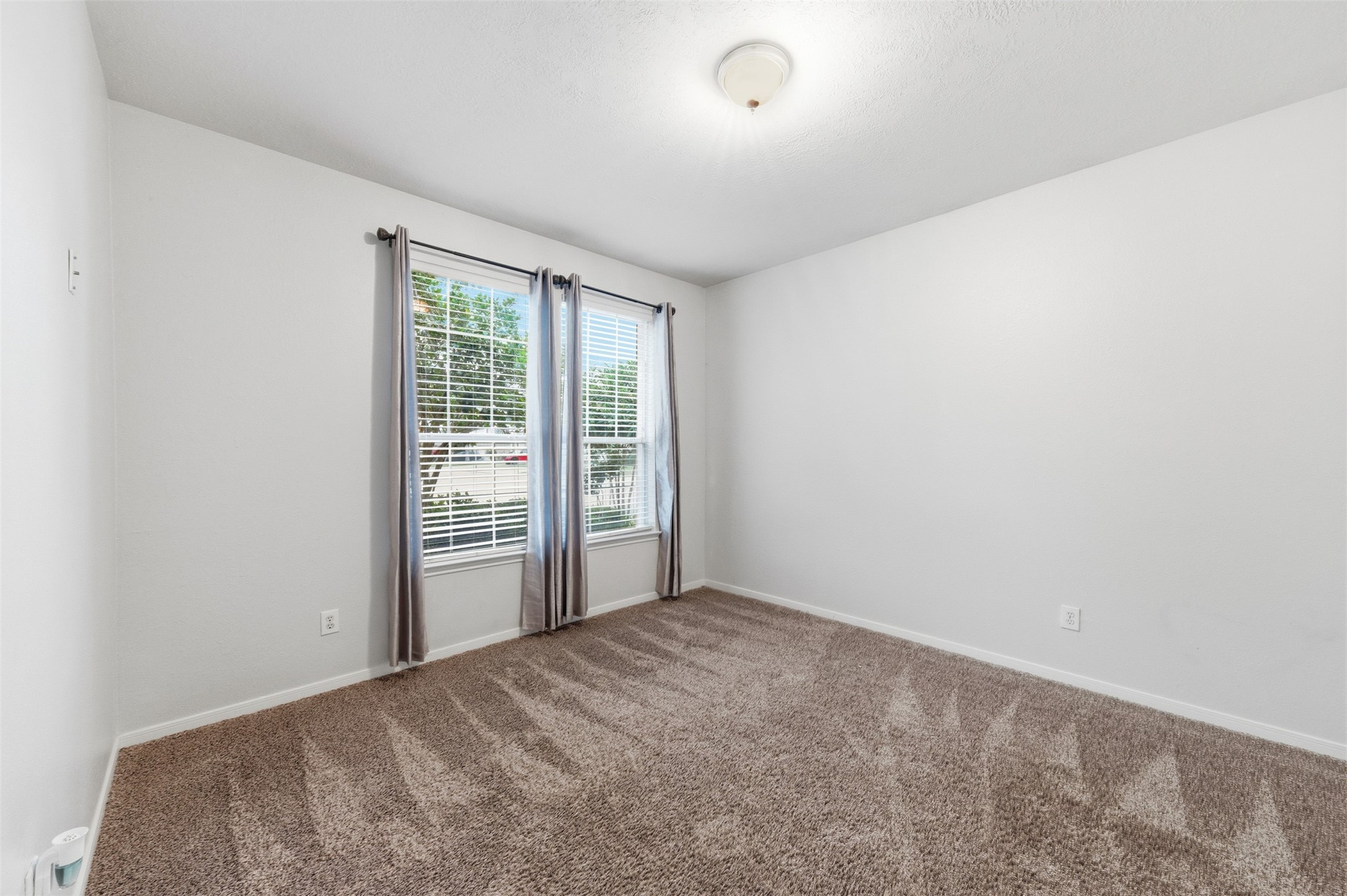 19710 Yaupon Ranch Drive Cypress, TX 77433 - Photo 24 of 34 an empty room with a window