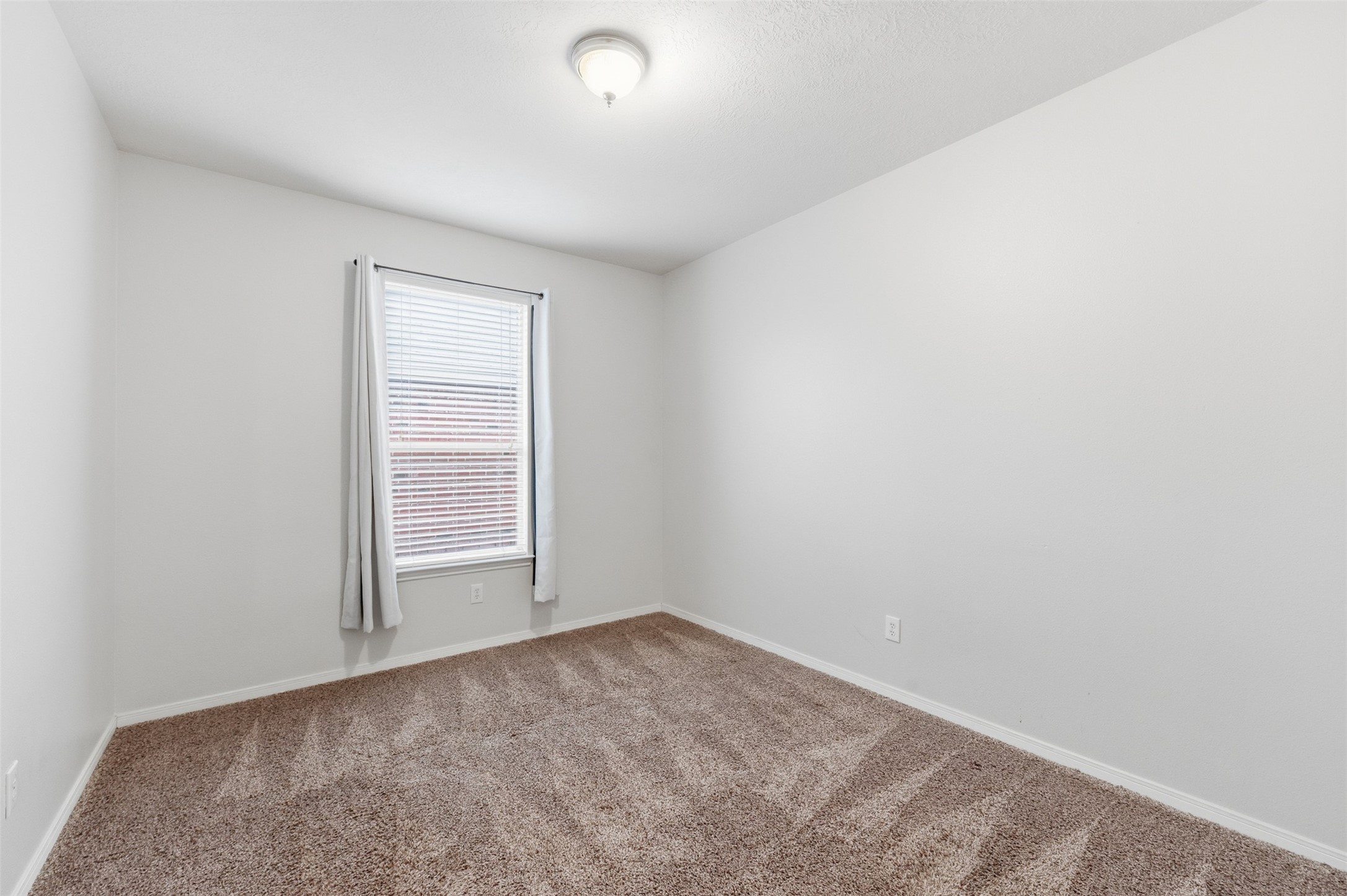 19710 Yaupon Ranch Drive Cypress, TX 77433 - Photo 29 of 34 an empty room with windows