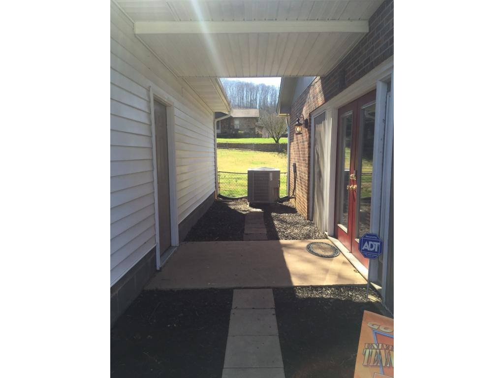 192 Price Road Elizabethton, TN 37643 - Photo 2 of 25 Breezeway between homegarage