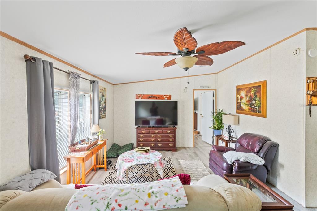 5670 Acadia Street Keystone Heights, FL 32656 - Photo 47 of 65 a bedroom with furniture and a large window
