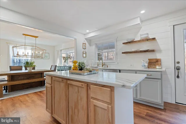 a kitchen with counter top space sink and outdoor space