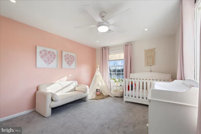 a bedroom with furniture and windows