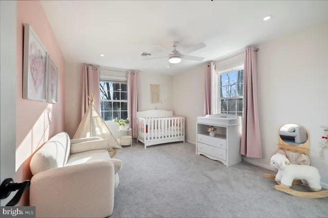 a bedroom with furniture and white walls